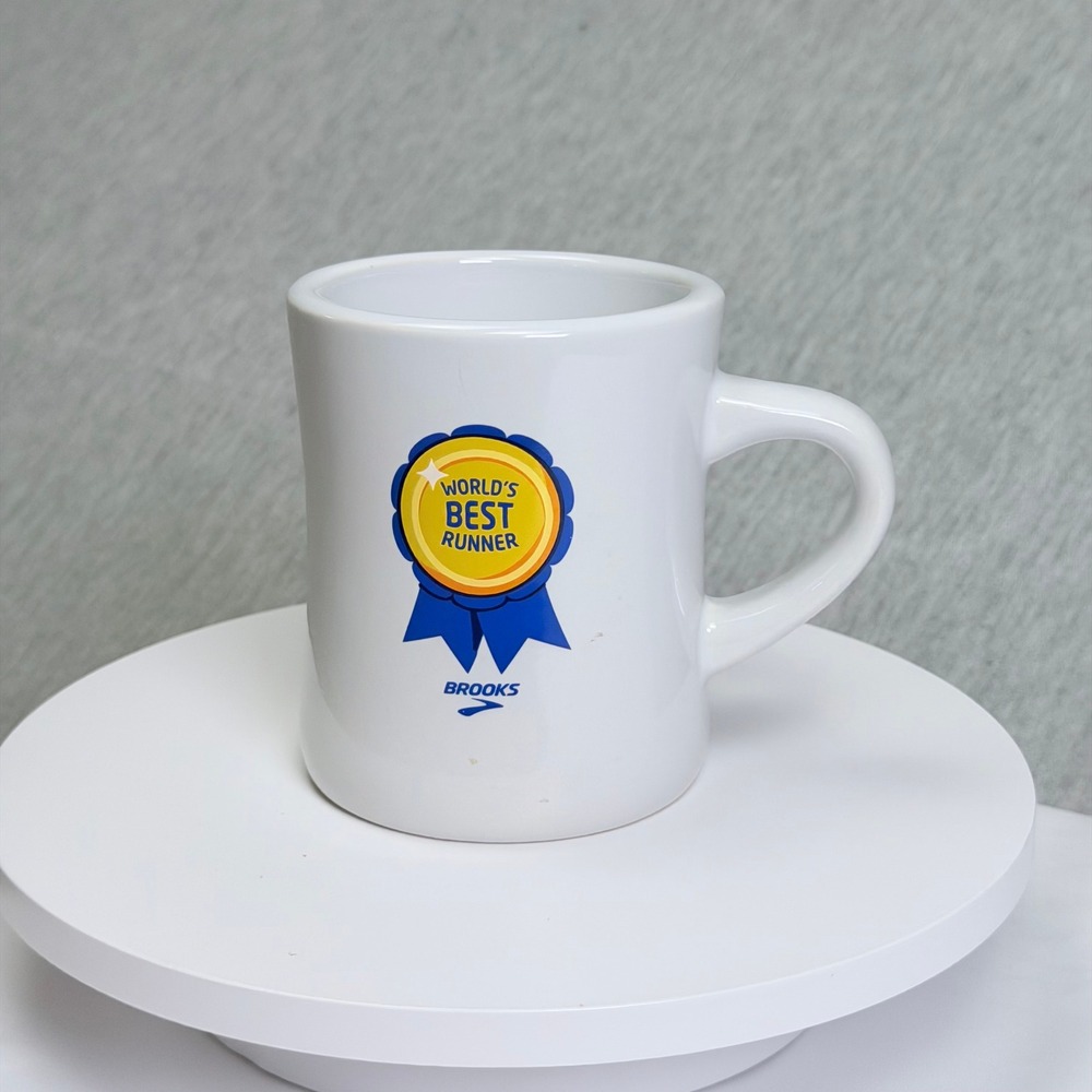 Brooks Running Worlds Best Runner Ceramic Coffee Mug White Blue Yellow Award